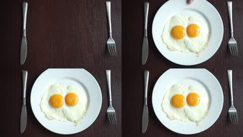 餐盘上的两个煎鸡蛋特写
