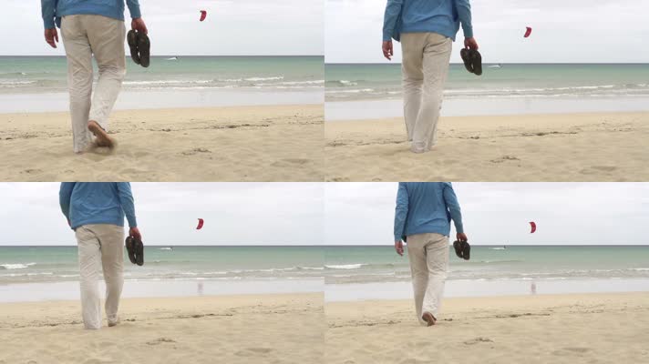 男子走在沙滩上空镜头