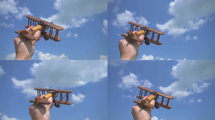 手拿木制飞机 放飞玩具飞机 