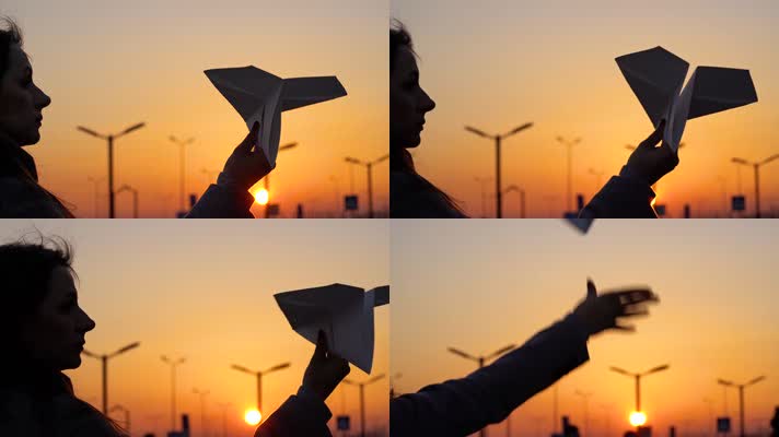 女孩手拿纸飞机 放飞纸飞机