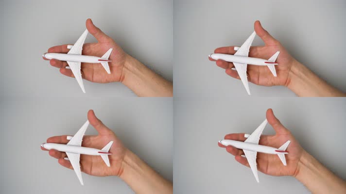 手拿玩具飞机 飞机模型 