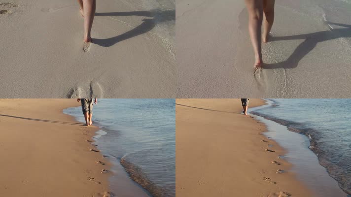 沙滩行走背影留下脚印