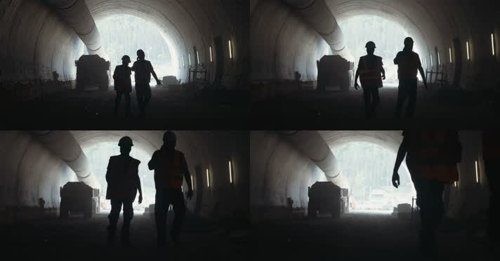 两名工人走过施工隧道 4K高清视频 