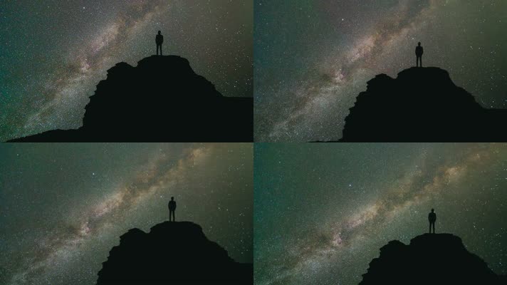 一个人站在山顶观看宇宙星空