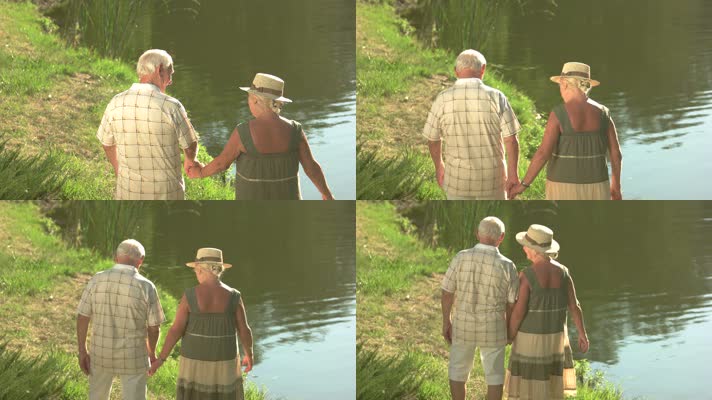 两位外国老人河边牵手散步 