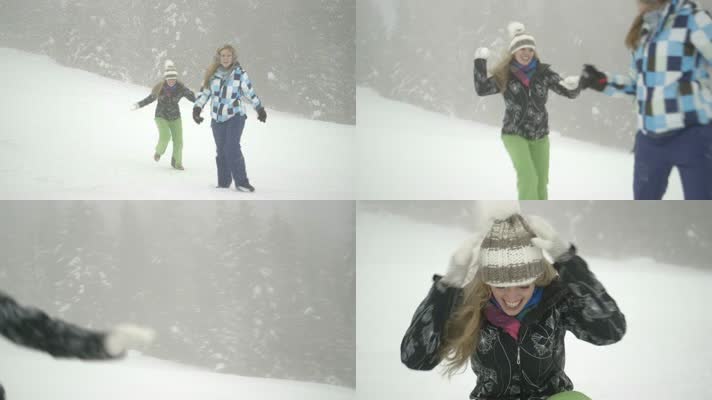 两位美女雪地打雪仗