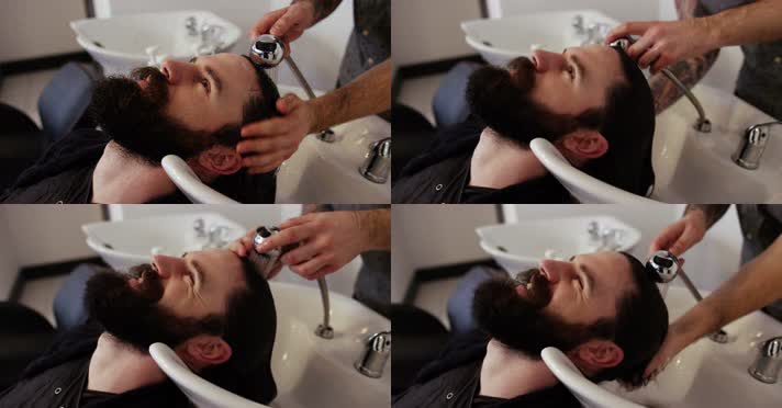 长发外国男在理发厅洗头发 4K视频