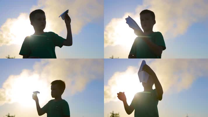 小男孩玩纸飞机
