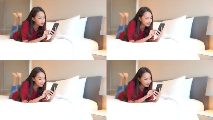 美女在床上玩手机