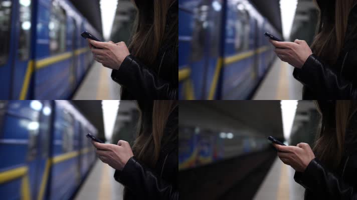 美女玩手机，地铁站等地铁