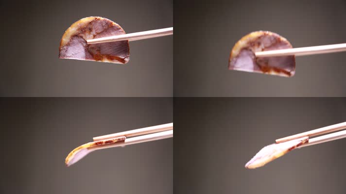 筷子夹起一片熟食卤肉 (3)