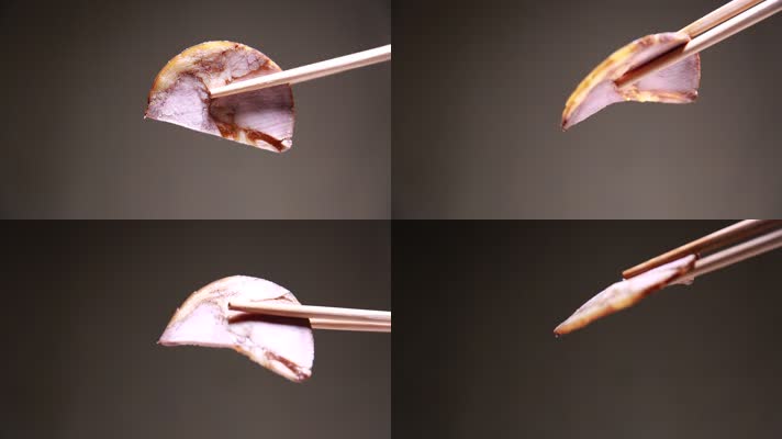 筷子夹起一片熟食卤肉 (1)