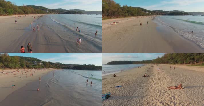 海岸沙滩视频夕阳下大海边海岸线沙滩上游客