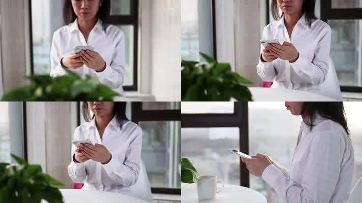 女性白领上班玩手机办公商务宣传