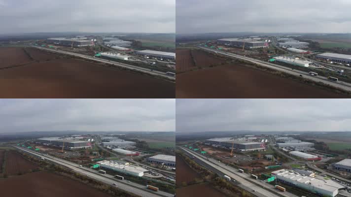 无人机拍摄的汽车、卡车和工业区为背景的高