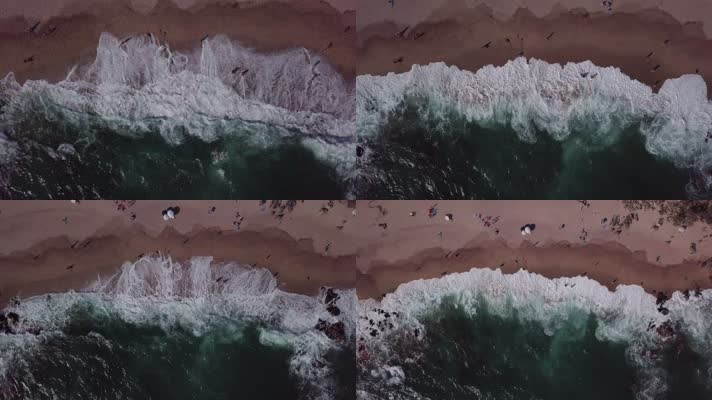 无人机从海浪汹涌的海滩上上升，拍摄于4k