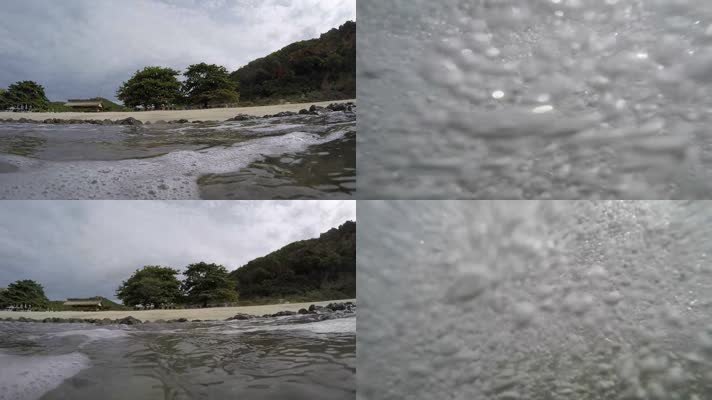 海浪拍打着水中的相机