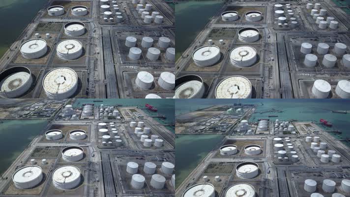 大型圆形白色气罐与管道系统连接在现代炼油