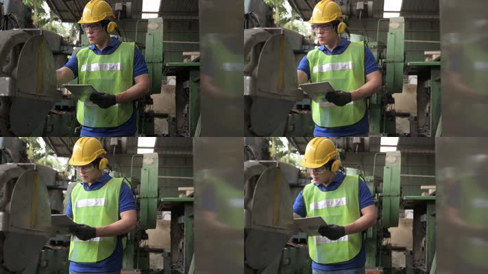 身着制服的亚洲男工程师在生产线上检查机器