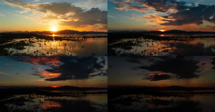 延时拍摄日落橙色光线反射在沼泽云层