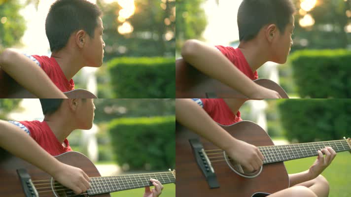 傍晚唯美夕阳下在小区草地上弹吉他的小男孩