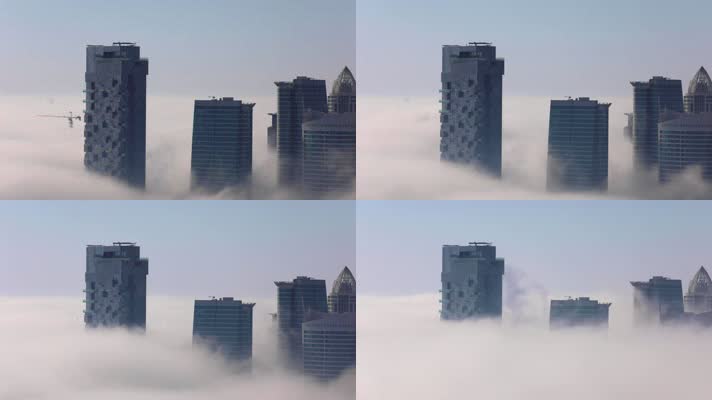 云层之上拍摄大厦云雾缭绕城市建筑