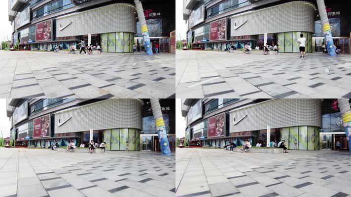 商场门口玩手机的人群人流延时摄影