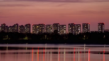 晚霞城市河水岸边建筑楼房夜晚灯光
