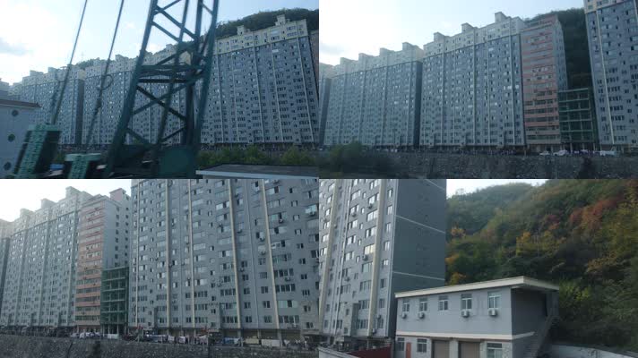 火车上拍摄秋天秦岭山中的城镇