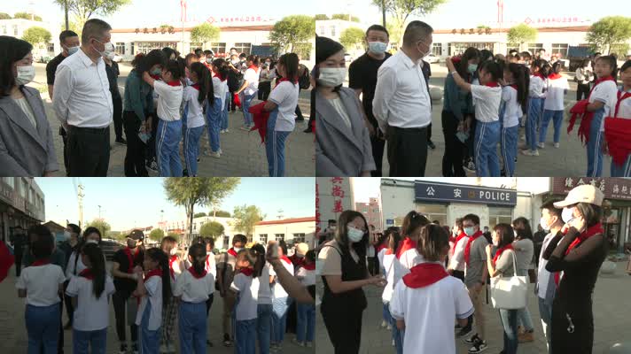 小学生给爱心人士系红领巾捐款捐物