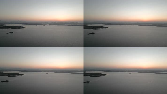 厦门环东海域晨光中的海边和城市建筑航拍