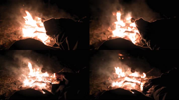 夜晚露营篝火取暖过夜