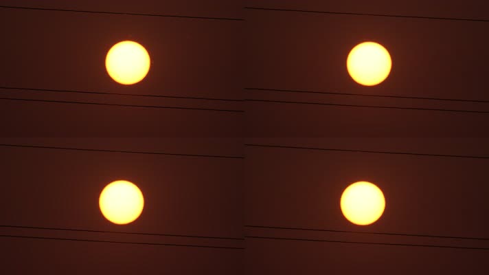 夏天麦田里电线杆中间的太阳