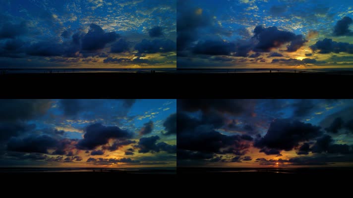 日落时分，云彩在五颜六色的天空中缓缓移动