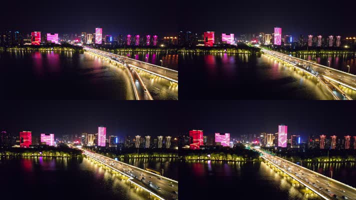 城市河岸边建筑楼群夜景航拍