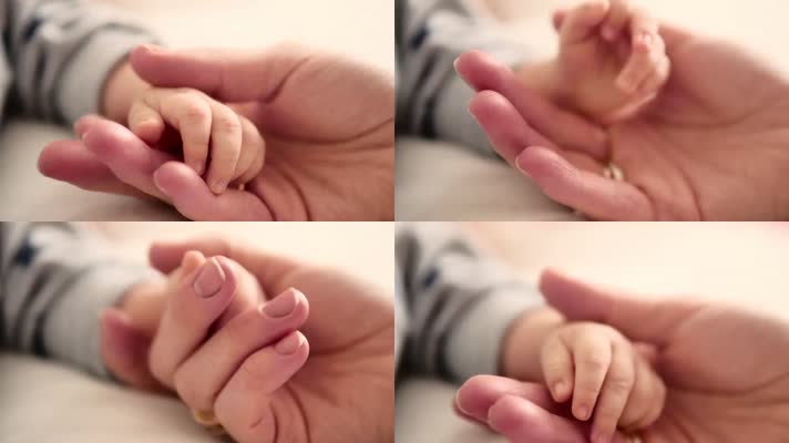 妈妈摸着宝宝的小手、婴儿小手