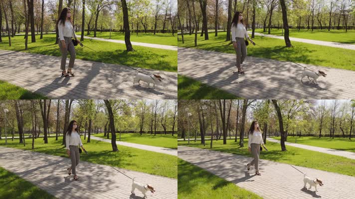 女孩在公园遛狗