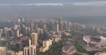 延时航拍广西体育中心日出丁达尔效应