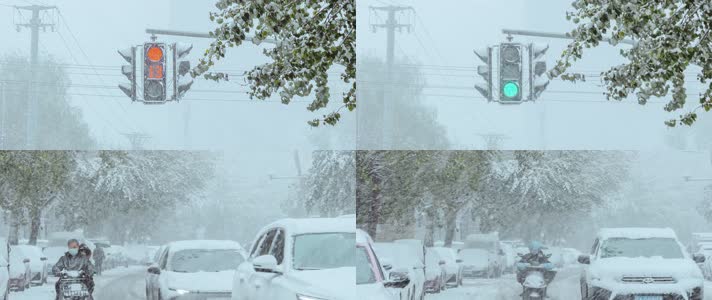 初冬大雪红绿灯信号灯马路车辆行人风雪北方