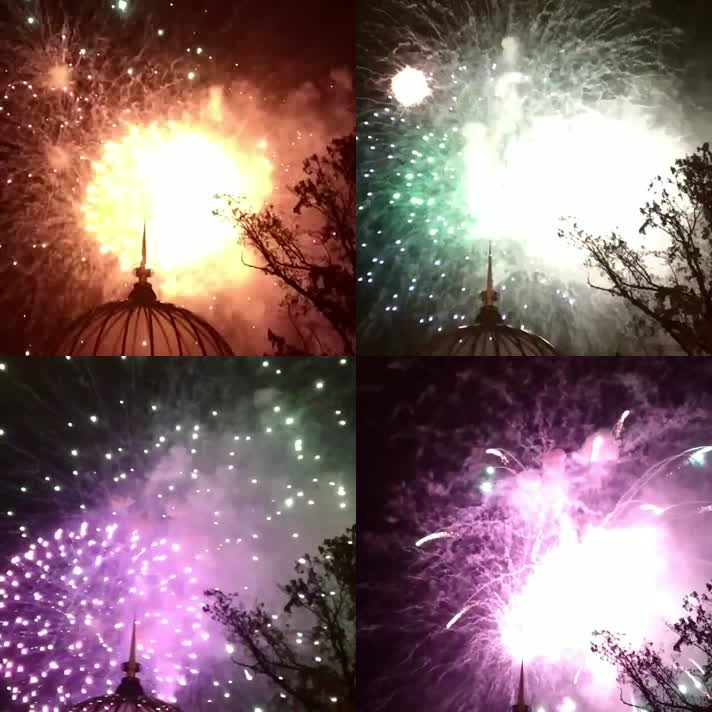 夜空中绽放的烟花绿色黄色金色