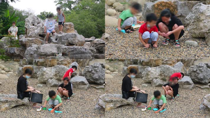 公园假山旁玩耍的小孩